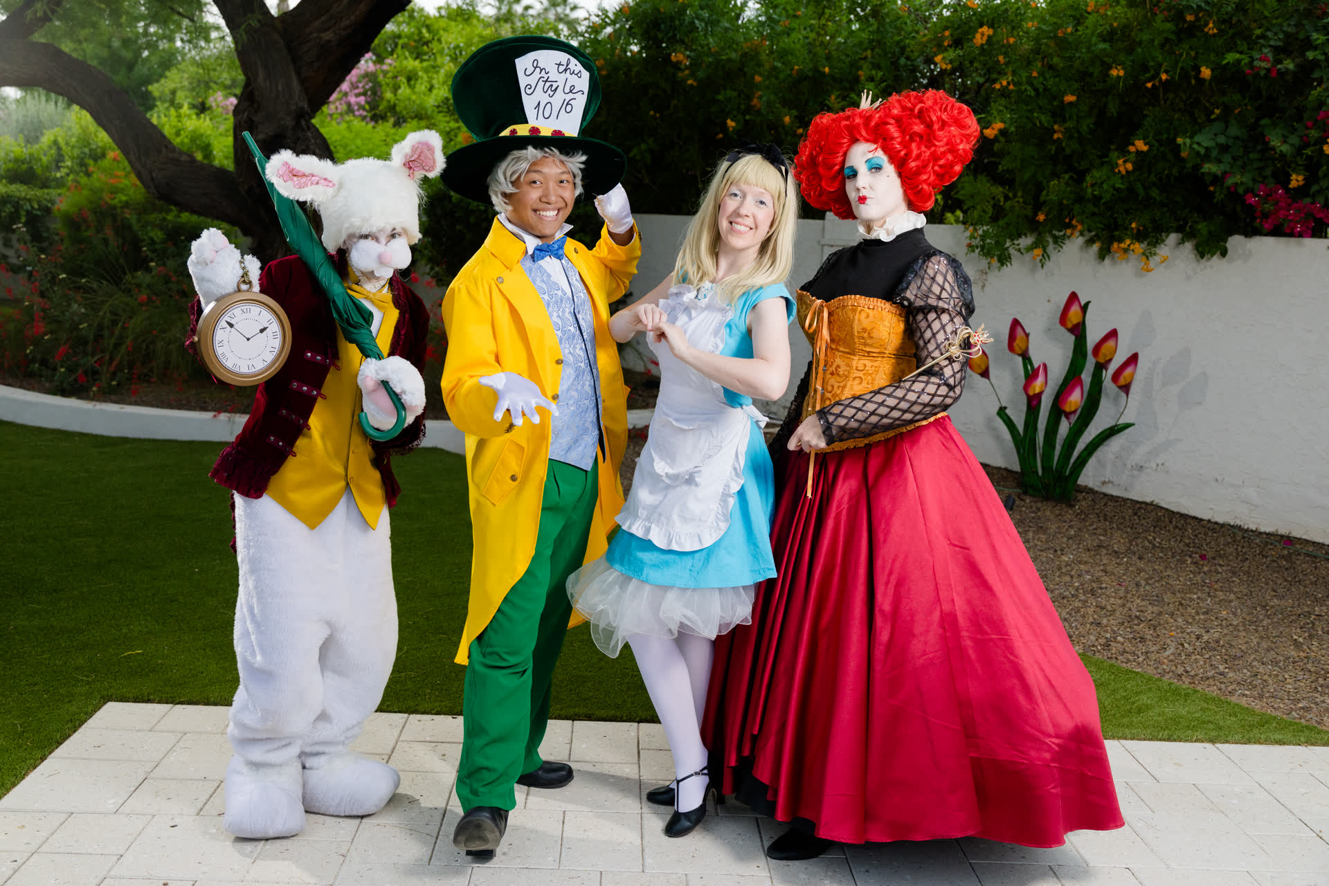 Storybook character performers — Alice in Wonderland garden tea